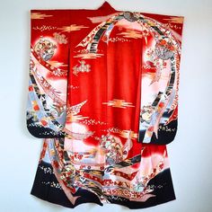 Authentic Japanese vintage kimono - Furisode, long sleeve kimono. Very gorgeously designed noshi bundle (auspicious strips of dried fish or seaweed). The Noshi pattern symbolizes longevity and is considered a lucky charm. Condition: There are minor spots as you can see in the last photo. But it's not very noticeable. This kimono is a preowned vintage item so cannot be expected to be in perfect condition. This gorgeous furisode kimono can be upcycled into a dress or various crafting ideas even if you don't want to wear it as a kimono. Approx.Size Length: 156cm Sleeve to sleeve: 125cm Back width: 58cm Sleeve length: 105cm Fully lined. Dry cleaning only. NOTE: The items are sold as is and we will not accept any return or exchange because of the aging signs and flaws. Please read the item desc Black Long Sleeve Samurai Kimono, Vintage Red Kimono For Tea Ceremony, Samurai Style Kimono For Tea Ceremony, Vintage Red Long Kimono, Vintage Long Red Kimono, Black Samurai Kimono With Kimono Sleeves, Traditional Red Kimono For Tea Ceremony, Black Long Sleeve Kimono For Tea Ceremony, Long Sleeve Black Kimono For Tea Ceremony