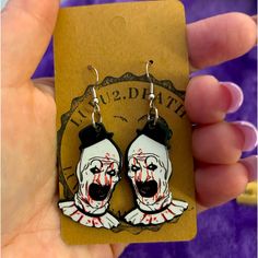 Unisex This Is A Pair Of Terrifier The Scary Clown Earrings, They Are Brand New Made By Me Comes From A Smoke-Free Home Never Worn Please Look At My Other Earrings. I Will Combine Shipping Up To 5 Pounds. Thank You For Looking In My Closet.! Black Novelty Jewelry For Costume Party, Black Halloween Costume Party Earrings, Novelty Black Earrings For Party, Novelty Black Party Earrings, Fun Black Earrings, Themed Black Earrings For Party, Themed Black Party Earrings, Punk Halloween Party Earrings, Handmade Fun Black Earrings