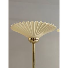 two lamps that are on top of each other in the same color and shape, one is gold