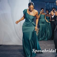 a man and woman in formal wear dancing