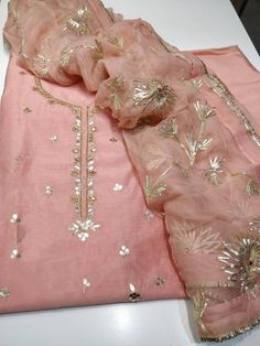 ***********Item Overview*********** ATHARVA Hand Embroidered Salwar Kameez • Beautiful Hand Embroidered Salwar Kameez • Beautiful Embroidered Neck /Jaal in Pink. • Beautiful Gota Pati Work Dupatta Fabric: • Shirt Chanderi Silk 2.5 Mts, • Dupatta: Pure Chiffon Chinnon 2.5 Mts (W/Gota Work Jaal) • Festive Unstitched Chinon Suit, Eid Chanderi Unstitched Suit With Gota Work, Fitted Embroidered Fabric With Gota Work For Festivals, Festive Chinon Unstitched Suit, Eid Gota Work Chanderi Unstitched Suit, Dola Silk Embroidered Fabric With Gota Work, Chanderi Traditional Wear With Gota Work For Eid, Festive Unstitched Dola Silk Suit, Festive Dola Silk Unstitched Suit