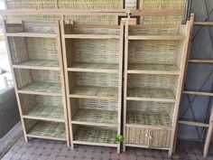 two wicker bookshelves sitting next to each other in a room with tile flooring