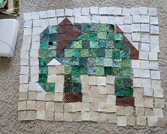 an elephant made out of tiles on the ground