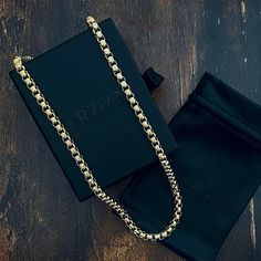 Catalyst is a modern version of the classic Italian Box Chain. This elegant Box Chain features interlocking links with rounded edges, complete with Forziani signature oversized clasp. Catalyst Chain is perfect for layering yet stands out on its own as a statement piece. Catalyst Box Chain Necklace Chain Width: 8mm Wide Chain Length: 26" and 30" Core Material: Stainless Steel Finish: Gold PVD Coated Clasp: Lobster Closure Elegant Chain Necklace With Chain Strap As Gift, Formal Box Chain Link Necklace, Cuban Link Necklace With Solid Link Construction As Gift, Cuban Link Necklace With Solid Link Construction, Luxury Metal Chain Necklace For Everyday, Gift Cuban Link Necklace With Solid Construction, Luxury Snake Chain Necklace For Formal Occasions, Everyday Luxury Metal Chain Necklace, Elegant Chain Link Necklace For Gift