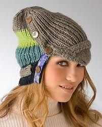 a woman wearing a knitted hat with buttons