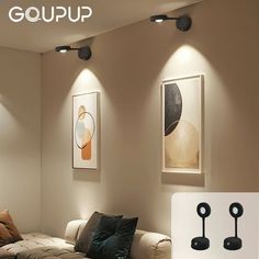 a living room with couches, lamps and pictures on the wall above them that says goup