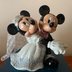 a mickey and minnie wedding cake topper