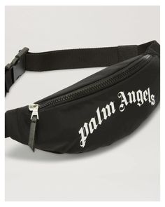 BLACK FANNY PACK WITH ZIPPER AND ADJUSTABLE BELT AND WITH CURVED PALM ANGELS LOGO PRINTED IN WHITE FRONTSIDE. 100% POLYESTER 100% COTTON Style# PBNO001C99FAB0031001 Black Fanny Pack, Angels Logo, Palm Angels, Adjustable Belt, Cotton Style, Fanny Pack, Zipper, ? Logo, White