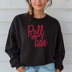 Get ready for game day and show your team pride with our Roll Tide Alabama Football Sweatshirt! This warm and cozy crewneck sweater is perfect for any Alabama fan. Whether you're cheering in the stands or watching from home, you'll be the most stylish fan in this Roll Tide sweatshirt. Sporty Crew Neck Top For Tailgating, Team Spirit Crew Neck Top For Tailgating, Tailgating Team Spirit Crew Neck Tops, Team Spirit Tops For Tailgating With Crew Neck, Casual Tops With Team Name For Tailgating, Collegiate Sweater For Game Day In Fall, Team-colored Fleece Top For Game Day, Collegiate Fall Sweater For Game Day, Collegiate Style Sweater For Game Day In Fall