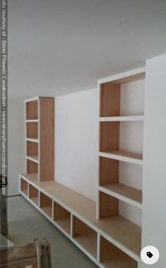 an empty room with some shelves in it