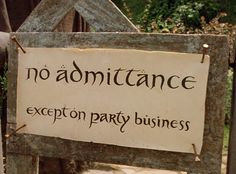 a sign that says no admittance except party business on it's wooden frame