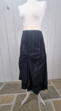 1990's long skirt, black with purple stripes. Camaïeu skirt. Washed and ready to wear. Cotton mix. Size: 36 E.U Waist / hips: 34 cm Length: 84 cm Fitted Black Tiered Maxi Skirt, Striped Fitted Long Skirt, High-waist Black Gathered Maxi Skirt, Striped Fitted Midi Skirt, Black Asymmetrical Gathered Maxi Skirt, Black Asymmetrical Gathered Skirt, Dark Purple Skirt, Stripes Skirt, Black Striped Skirt