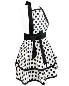 a white and black dress with polka dots on it