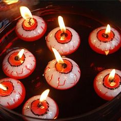 there are many candles that have been placed in the bowl for decoration or to burn