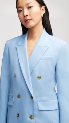 Made of an Italian Seasonless Wool, this elevated classic features traditional suiting details like a double-breasted closure, a peak label, sculpted shoulders, and interior pockets. Our Double-Breasted Blazer pairs great with a pair of chic trousers or dressed down with a classic tee and denim combo. Tailored Pantsuit With Button Closure For Semi-formal Occasions, Tailored Single-breasted Structured Blazer Dress, Classic Fitted Structured Blazer Dress, Fitted Classic Structured Blazer Dress, Tailored Structured Blazer Dress For Formal Occasions, Classic Fitted Blazer Dress, Timeless Double-breasted Buttoned Suit, Timeless Double-breasted Suit With Buttons, Timeless Double-breasted Suit