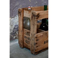 two wooden crates with beer bottles in them