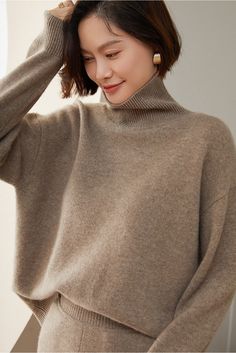 Material: 100% Cashmere Indulge in the epitome of comfort and luxury with our Turtleneck 100% Pure Cashmere Sweater. Crafted from the finest and softest cashmere, this sweater offers a warm embrace on chilly days. The classic turtleneck design not only provides added warmth but also exudes timeless sophistication. Care: To maintain its plush texture and long-lasting durability, we recommend professional dry cleaning or hand washing in cold water with a mild wool detergent. Gently reshape the swe Beige Fine Knit Winter Turtleneck, Winter Beige Fine Knit Turtleneck, Elegant Beige Turtleneck For Winter, Elegant Beige Winter Turtleneck, Brown Cashmere Turtleneck Top, Solid Cashmere Turtleneck For Workwear, Elegant Wool Turtleneck For Winter, Elegant Soft Knit Winter Turtleneck, Elegant Soft Knit Turtleneck For Winter