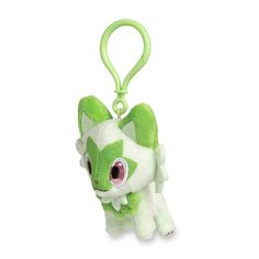 a green and white stuffed animal keychain