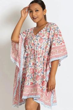 This soft cotton mini caftan makes a great swimsuit cover-up or comfy dress! Empire waist half sleeve women's mini caftan with v-neck is made of breezy, lightweight, 100% cotton. This caftan mini dress features an adjustable drawstring gather at the waist for whether you prefer a relaxed or fitted look. The material for this short caftan dress is hand block-printed by artisans in Rajasthan, India. The wooden blocks are first hand-carved and the design is then hand-stamped using a different block Beach V-neck Printed Kaftan, Bohemian V-neck Kaftan For Vacation, Summer V-neck Kaftan For Beach Season, White Printed V-neck Kaftan, Flowy V-neck Tunic For Beach Cover-up, Summer V-neck Kaftan For Beach Cover-up, Summer V-neck Tunic For Loungewear, Casual Beach Tunic With Split Neck, Summer V-neck Beach Dress For Loungewear