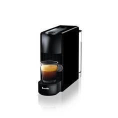 an espresso machine with a cup of coffee in front of it on a white background