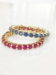 three stacking rings with different colored stones