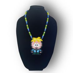 South Park Necklace with Butters Animated Character. This Kandi rave necklace is 14 inches in length and is made to sit on the bust for most body types Handmade Green Novelty Necklace, South Park Kandi, Rave Necklace, South Park Butters, Kandi Rave, Kandi Necklace, Kid Crafts, Beaded Necklaces, Animated Characters