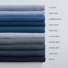 a stack of folded blue and white linens on top of each other, with the words ice blue below them