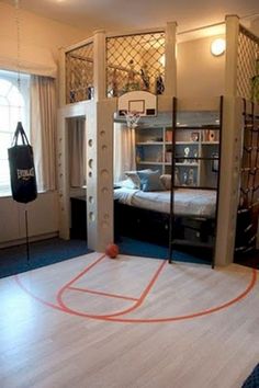 an indoor basketball court in the middle of a living room with bunk beds and windows