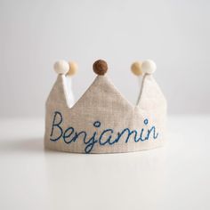 a small crown with the word benjamin written on it's front and sides