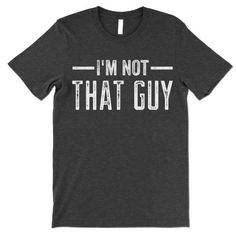 I'm Not That Guy short-sleeve crewneck t-shirt. Unisex Fit. Printed with eco-friendly water-based inks. Please refer to the size chart in the last image of the listing (laying flat measurements in inches). Due to the calibration differences between computer monitors, phone screens and tablets, the actual product color may vary slightly from what you are viewing.SHIRT FEATURES:- 4.2 oz., Solid color tees (red, white, blue, green) are 100% combed and ringspun cotton, 30 singles- Athletic Heather S Gray Graphic Tee With Funny Text, Unisex Gray Short Sleeve T-shirt, Gray Letter Print T-shirt, Funny Nerd, Gay Pride Shirts, Gay Humor, Pride Outfit, Phone Screens, Charcoal Color