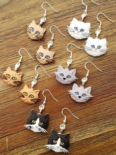 "Kitty faces on nickel free earwire. 1.75\" x 1\"" Cute Cat Ears Earrings With Cat Print, Adjustable Cute Cat Design Earrings, Cute Adjustable Cat Design Earrings, Cute Cat Design Adjustable Earrings, Cute Cat Design Dangle Earrings, Cute Cat Design Drop Earrings, Beaded Chandelier Earrings, Beaded Chandelier, Leather Bar