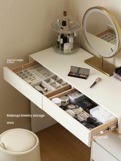 an organized makeup drawer is shown with its contents in the drawers and mirror above it