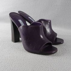 Prada Milano Purple Peep Toe Wide Band Stacked Heel Mule Size 38.5 New $690 Anb Brand New Without A Box. These Shoes Are Absolutely Gorgeous. The Leather Is Soft And The Way The Leather Is Curved, There Are Some Natural And Normal Wrinkling. Approximately 5" Stacked Heel. Prada Logo Charm Is On The Bottoms Of The Shoes. Some Sticker Residue On The Bottoms. Pics Are Of The Item You Are Purchasing. Please See Pics For Condition Of Item And Contact Us Prior To Purchase With Any Questions. Colors Ma Designer Purple Sandals For Formal Occasions, Designer Patent Leather Slip-on Heels, Designer Calf Leather Slip-on Heels, Luxury Round Toe Purple Sandals, Luxury Purple Sandals With Round Toe, Designer Slip-on Heels With Padded Heel, Luxury Purple Round Toe Sandals, Luxury Purple Leather Sandals, Designer Almond Toe Sandals With Reinforced Heel