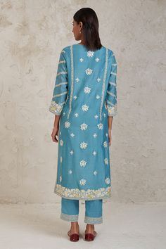 Blue A-line kurta with floral gara and dori embroidery. Paired with embroidered hem pant and embroidered dupatta.
Components: 3
Pattern: Embroidered
Type Of Work: Dori, Gara
Neckline: Notched
Sleeve Type: Long
Fabric: Handwoven Pure Chanderi
Color: Blue
Other Details: 
Embroidered pant
Dori and gara work
Occasion: Puja - Aza Fashions Blue Chikankari Embroidery Palazzo Set For Summer, Blue Chikankari Embroidered Palazzo Set For Summer, Summer Blue Palazzo Set With Chikankari Embroidery, Blue Silk Palazzo Set With Intricate Embroidery, Blue Designer Palazzo Set For Spring, Spring Designer Blue Palazzo Set, Blue Chanderi Palazzo Set With Intricate Embroidery, Blue Palazzo Set With Intricate Embroidery In Chanderi, Blue Resham Embroidery Palazzo Set For Summer