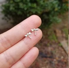 These sterling silver dragonfly earring studs are the perfect gift for that special someone in your life. Stylishly and minimalistic, they will never go out of style and can be worn everyday. Crafted with hypoallergenic nickel free sterling silver to suit any skin type, these small and dainty earrings are sure to be a showstopper. Every woman has a unique sense of style, and these earring studs will enhance it with their understated beauty. Finish: plain sterling silver or gold plated over sterl Dainty Hoop Earrings, Initial Earrings, Butterfly Earrings Stud, Open Hoop Earrings, Sterling Silver Initial, Dragonfly Earrings, Tiny Studs, Tiny Stud Earrings, Earring Sale