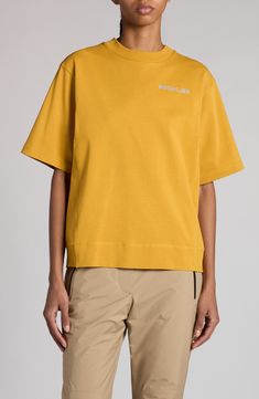 Signature scrambled logos scatter across a short-sleeve sweatshirt crafted from comfortable cotton in a mustard-inspired hue. Crewneck Elbow-length sleeves Dropped shoulders 100% cotton Machine wash, line dry Imported Designer Clothing Yellow Tops With Logo Print, Cotton Sweatshirt With Logo Print And Short Sleeves, Mustard Cotton Crew Neck Tops, Sporty Yellow Crew Neck Top, Mustard Oversized Casual Top, Casual Oversized Mustard Top, Sporty Mustard Cotton Tops, Summer Wardrobe Essentials, Sweatshirt Short Sleeve