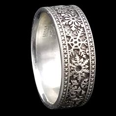 a wedding ring with intricate designs on it