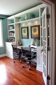 a home office with two chairs and a desk