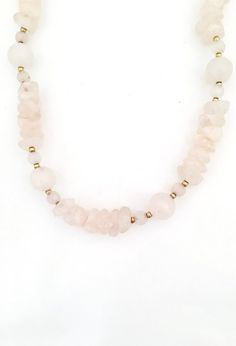 This is a beautiful vintage necklace made with rose quartz and small gold beads. It is strung with thread And has a gold hook and eye closure.  Rose quartz is a light rose pink.  According to Energy Muse It is believed to restore trust and harmony in relationships, encouraging unconditional love.  Some believe that it purifies and opens the heart at all levels trip about love, self love, friendship, deeper into healing and feelings of peace.This rose quartz necklace is 30 inches long. It is in e Adjustable Rose Quartz Beaded Necklace For Healing, Handmade Rose Quartz Beaded Necklaces For Healing, Hand-strung Pink Rose Quartz Necklace, Rose Quartz Beaded Necklaces With Natural Stones, Rose Quartz Beaded Necklace With Natural Stones, Gold Rose Quartz Crystal Necklace With Natural Stones, Bohemian Rose Quartz Beaded Necklace With Gemstones, Bohemian Rose Quartz Gemstone Beaded Necklace, Gold Crystal Necklace With Natural Rose Quartz Stones