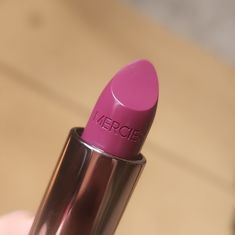 Violette Is A Very Warm-Toned, Medium-Deep Plum With Subtle, Cool Undertones And A Satin Sheen. It Had Rich Color Coverage In A Single Layer, Which Adhered Evenly And Smoothly To My Lips With Even Application That Never Tugged On My Lips. The Texture Felt Smooth, Lightweight, And Velvety With A Thinness That Wasn't Clingy. It Stayed On Nicely For Six Hours, Left A Stain Behind, And Felt Lightly Moisturizing While Worn. No Longer Available On The Sephora Website The "G" Marks Are From Previous Wo Purple Mauve Lipstick, Lipstick Purple, Purple Pink Lipstick, Deep Purple Lipstick, Laura Mercier Lipstick, How To Make Lipstick, Laura Mercier Makeup, Deep Plum, Hydrating Lipstick