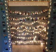 a room with lights and pictures on the wall, all decorated in white string lights