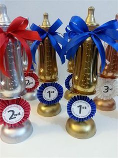 four small bottles with ribbons around them