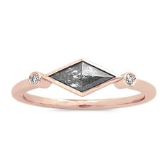 This beautiful ring is a masterpiece of craftsmanship  featuring a kite-shaped natural pepper diamond and a pair of classic natural diamond accents  all set in romantic 14-karat rose gold. It makes a unique gift or a beautiful treasure for yourself. Rose Gold Diamond Rings With Trillion Cut, Trillion Cut Ethical Diamond Ring In Rose Gold, 14k Rose Gold Rose Cut Diamond Ring, Luxury Trillion Cut Rose Diamond Ring, Elegant Trillion Cut Diamond Ring With Rose Cut Diamonds, Elegant Trillion Cut Rose Diamond Ring, 14k Rose Gold Diamond Ring With Bezel Setting, Elegant Rose Gold Trillion Cut Ring, 14k Rose Gold Promise Ring With Rose Cut Diamonds