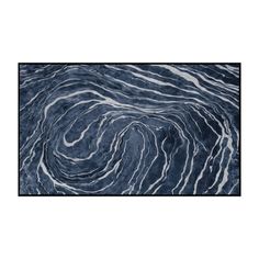 an abstract blue and white rug with wavy lines