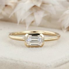 an engagement ring with a baguette cut diamond