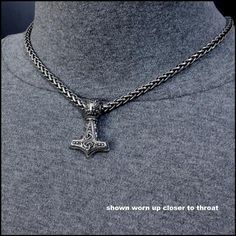 Share your love of the legend of Thor's Hammer and Norse Mythology by owning and wearing this beautifully detailed reproduction of an ancient Mjolnir Thor's Hammer on premium quality antique Viking braid chain necklace. It is sure to get admiring looks and start conversations wherever you wear it. The necklace comes with my signed certificate of authenticity, deluxe gift box and velvet jewelry pouch.Look closely, the hammer is truly a work of art. The hammer is cast in solid stainless steel rich Symbolic Jewelry With Steel Shank As Gift, Medieval Style Oxidized Jewelry As Gift, Medieval Style Jewelry With Oxidized Finish As Gift, Viking Style Engraved Jewelry As Gift, Viking Style Engraved Jewelry Gift, Viking Style Engraved Jewelry For Larp, Adjustable Wheat Chain Jewelry As Gift, Viking Style Engraved Jewelry For Gift, Antique Wheat Chain Jewelry Gift