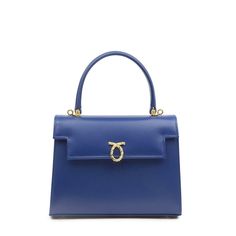 Judi Handbag in Royal Blue/NavyA smaller version Launer's most famous Traviata design. The leather used to make these soft leather handbags is imported from Italy and only butter-soft, unblemished hides are selected. Every piece has perfectly rounded corners and smooth, turned-edging- a hallmark of the highest quality leatherwork. Just as elegant as the exterior, the interior is fully lined in Italian suede. Craftsmanship is paramount. Every piece of leather is hand-cut, every seem handsewn, and Launer London, Navy Interior, Luxury Leather Bag, Soft Leather Handbags, Treat Yoself, Popular Bags, Blue Suede, Small Leather Goods, Soft Suede