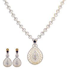 Add the sophistication of diamonds to your favorite formal or traditional outfits for a special occasion. This shimmering 18 karat gold necklace and earrings set has a beautiful array of diamonds and jewels that will light up any room. Features• 18K Yellow Gold• DiamondsVirani Jewelers diamond jewelry is meant to make you radiant with elegant beauty. Each piece of diamond jewelry we carry is GIA certified. Find the perfect diamond jewelry for yourself or someone special on our website. Specifica Formal White Diamond Necklace With Intricate Design, Elegant Festive Jewelry Sets With Diamond Accents, Luxury Diamond Necklace With Intricate Design For Celebration, Exquisite Diamond Necklace For Festive Occasions, Luxury Diamond Necklace For Reception With Intricate Design, Elegant American Diamond Jewelry Set With Intricate Design, Elegant American Diamond Jewelry Sets For Festive Occasions, Formal Diamond White Necklace With Intricate Design, Traditional Formal Diamond Necklace With Single Cut Diamonds