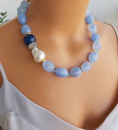 📍 Description :  The handmade necklace has been designed with Baroque Pearl, Quartz gemstone in blue colour and Agate gemstone in dark blue colour.  The colours of the stones may differ slightly in photo shoots caused by lighting and reflections. ✂ Materials : The natural stones used are;  Baroque Pearl, Quartz gemstone in blue colour and Agate gemstone in dark blue colour.   The chain and gold-colored materials used are 14 carat gold plated on brass and do not tarnish. 📐 Dimensions : The neck Handmade Anniversary Gifts, Stone Jewelry Necklace, Dark Blue Colour, Faceted Bead Bracelet, Pearl Jewelry Design, Semiprecious Stone Jewelry, Princess Necklace, Short Necklace, Blue Colour