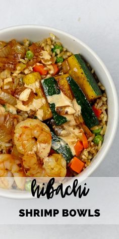 a white bowl filled with shrimp, rice and veggies